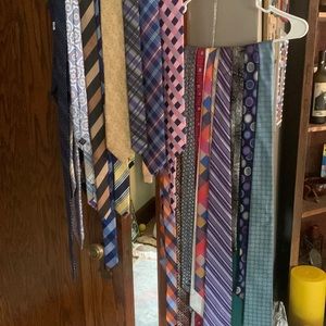 Assorted name brand ties , variety of colors and patters